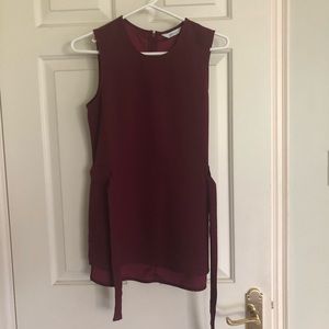 Maroon sleeveless blouse with belt